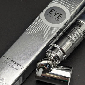 Silver eye cream bottle with packaging